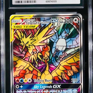May include: A graded Pokémon card featuring Moltres & Zapdos & Articuno GX. The card has a colourful illustration of the three legendary birds. The card is graded GEM MINT 10 by CGC and is from the Hidden Fates Elite Trainer Box.