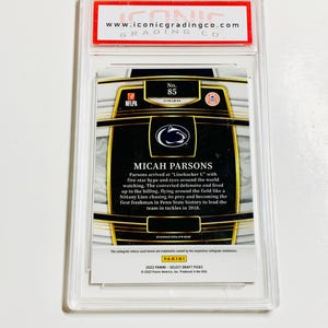 May include: A graded sports trading card featuring Micah Parsons, a football player. The card is encased in a clear plastic holder with the text "MICAH PARSONS" and "2022 PANINI - SELECT DRAFT PICKS". The card is graded by Iconic Grading Co.