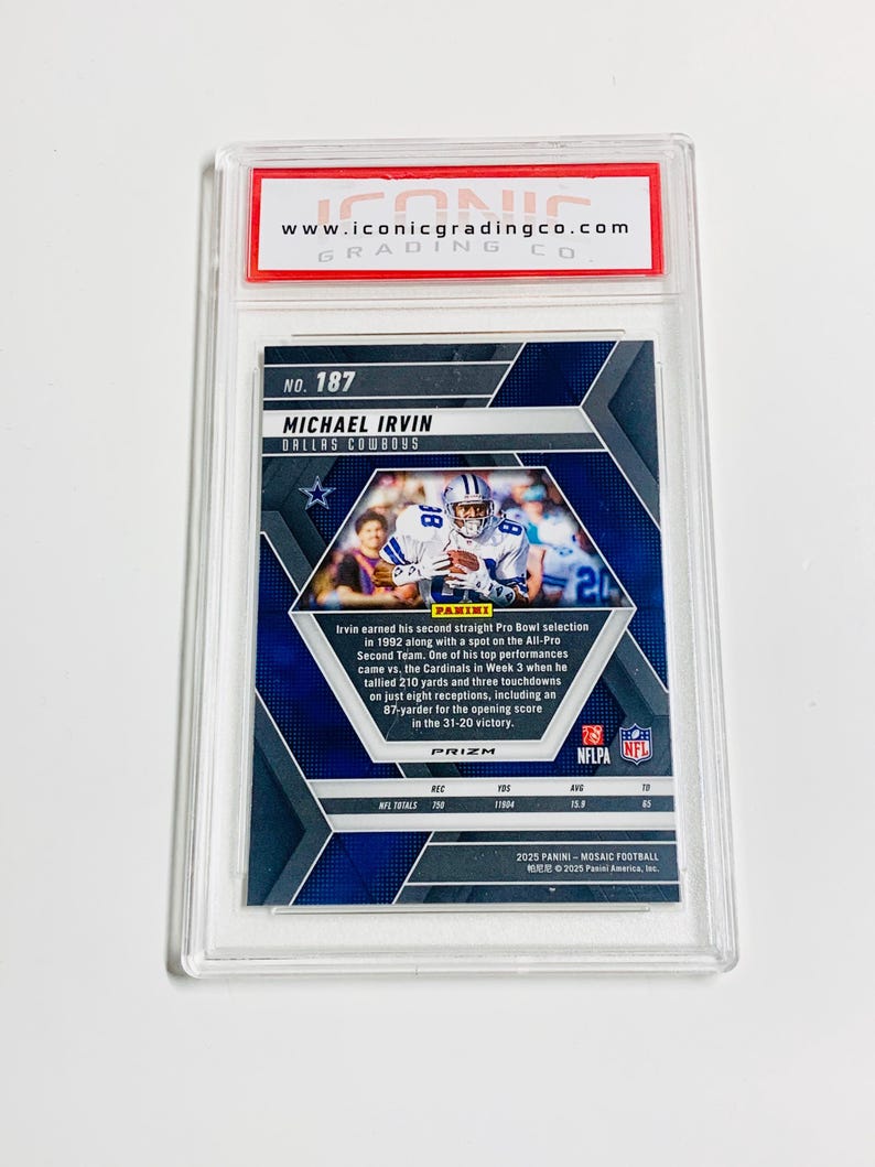 May include: A Michael Irvin Dallas Cowboys football card, graded and encased in a protective holder. The card features a photo of Irvin in his Cowboys uniform and details his achievements. The card is from the 2025 Panini Mosaic Football series.