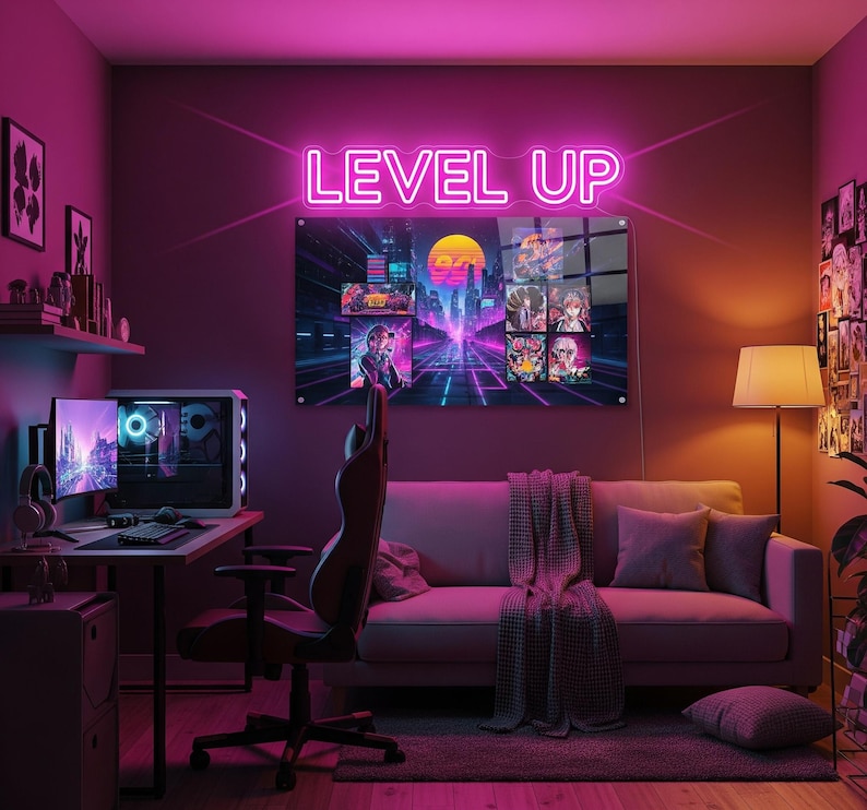 May include: A neon sign that reads "LEVEL UP" above a gaming setup. The room is lit with pink and purple hues, featuring a computer, gaming chair, and a couch. A large framed artwork with retro gaming graphics hangs on the wall.