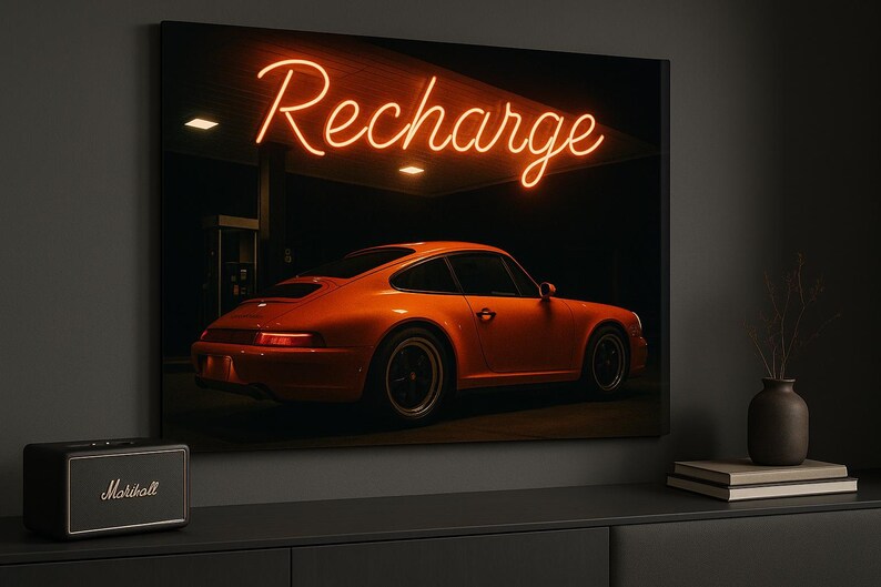 May include: Orange sports car parked under a neon sign that reads "Recharge." The car is the focal point, set against a dark background. The image is a canvas print, with a Marshall speaker in the foreground.