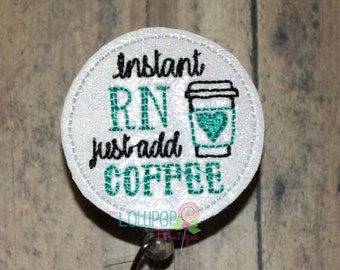 May include: White round badge with the text "Instant RN just add coffee" and a green coffee cup with a heart on it. The badge is attached to a clear plastic retractable badge holder.