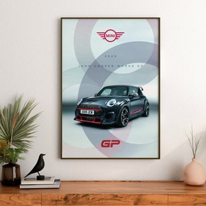 May include: A black Mini Cooper John Cooper Works GP with red accents and the registration plate "OX19 JCW". The car is surrounded by a white and grey circular pattern. The text "MINI" and "2020 JOHN COOPER WORKS GP" are also visible on the poster.