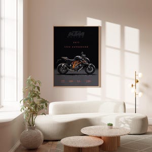May include: A black and orange KTM 1290 Superduke motorcycle poster with the text "KTM Racing 2017" on a black background.