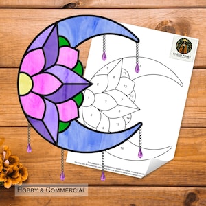 May include: A stained glass pattern of a crescent moon with a flower design. The pattern is numbered for easy assembly. The pattern is for hobby and commercial use.