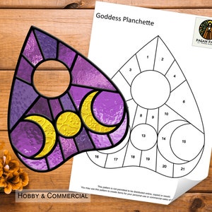 May include: A printable pattern for a stained glass planchette featuring a triple moon design in purple and yellow. The pattern is labelled "Goddess Planchette" and includes numbered sections for cutting and assembling the glass pieces. The pattern is for hobby and commercial use.