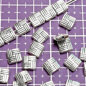 8 millimeter puff square beads with a basketweave design