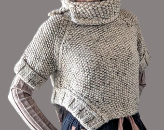 Hand Knit loose fitting cropped pullover with asymmetric curved side and cowl collar. Uniquely designed and made to order from chunky wool.