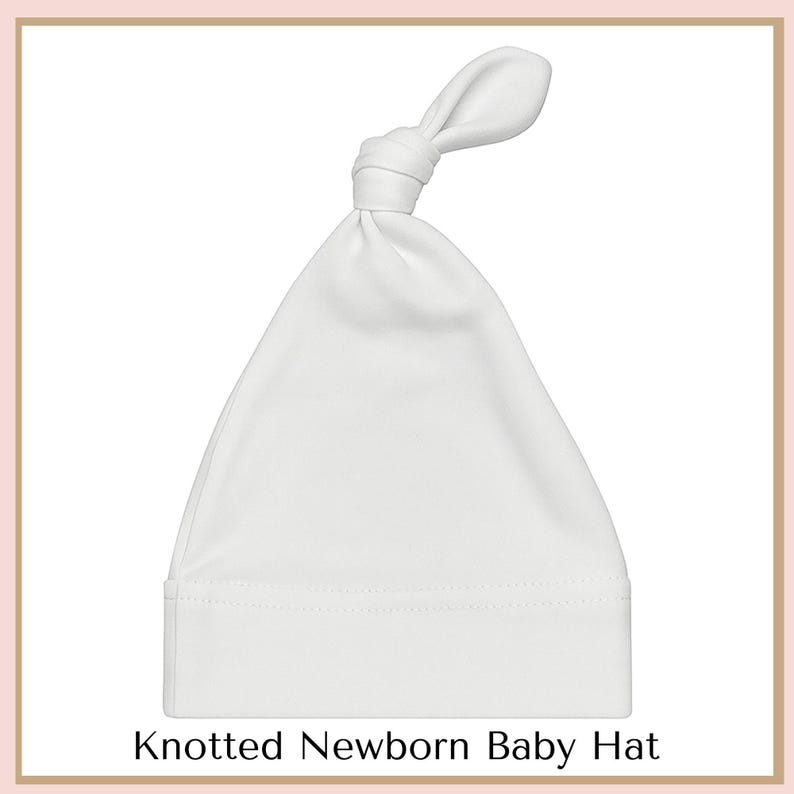 A white newborn baby hat with a knotted bow at the top.
