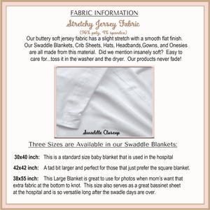 The image is a close-up of a swaddle blanket, showcasing its soft texture and smooth finish.