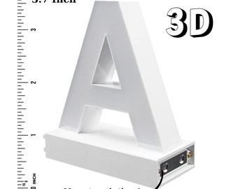 May include: White 3D plastic letter A, 3.7 inches tall. The letter has a hollow center and magnets on both sides. The letter is on a white base with a black power cord.