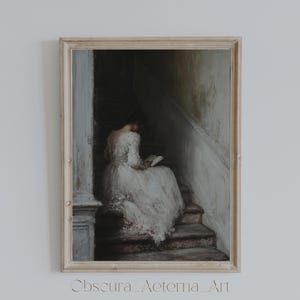 May include: A framed painting of a woman in a white dress sitting on a staircase, reading a book. The painting is set in a dimly lit room with a white wall behind the woman.