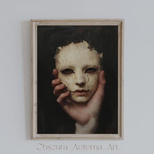 May include: A painting of a hand holding a white mask with cracks and stitches. The mask has a sad expression and is set against a dark background.