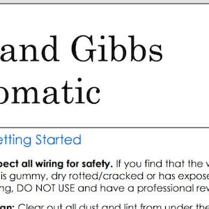 May include: An antique Willcox and Gibbs Automatic sewing machine, black with gold accents, is displayed. The image includes text about the machine's features and safety instructions. The machine is a domestic chain stitch model.