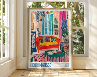 May include: A colourful abstract painting of a living room interior with a red sofa, a green coffee table, and a window with blue and white panes. The painting is titled "HENRI MATISSE" and has the text "FRANCE COLLAGE EXHIBITION" at the bottom.