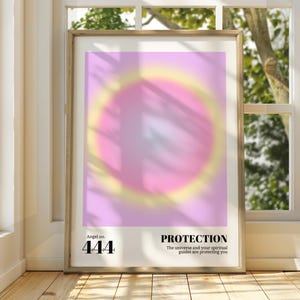 May include: A pink and yellow gradient poster with a circle in the center. The poster has the text "Angel no. 444" and "PROTECTION. The universe and your spiritual guides are protecting you."