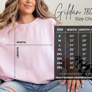 May include: A light pink crewneck sweatshirt with a size chart. The chart lists measurements in inches for sizes S to 5XL. The sweatshirt is a heavy blended crewneck.