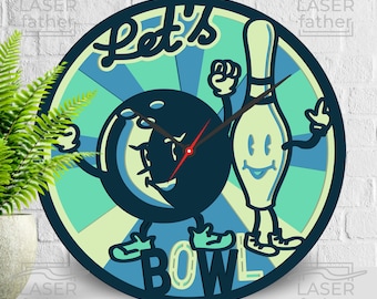 May include: A round wall clock with a bowling theme. The clock face features a cartoon bowling ball and pin with arms and legs. The words "Let's BOWL" are displayed on the clock face. The clock hands are red.