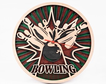 May include: A wooden wall clock with a bowling ball and pins design. The clock face is green and brown with a black and white bowling ball and pins design. The clock hands are black and red. The clock face says "BOWLING" in black letters.