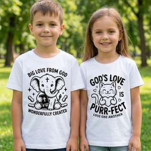 May include: Two children wearing white t-shirts with graphic designs. One shirt features an elephant holding a book with the text "BIG LOVE FROM GOD WONDERFULLY CREATED." The other shirt has a cat holding a heart with the text "GOD'S LOVE IS PURR-FECT LOVE ONE ANOTHER."