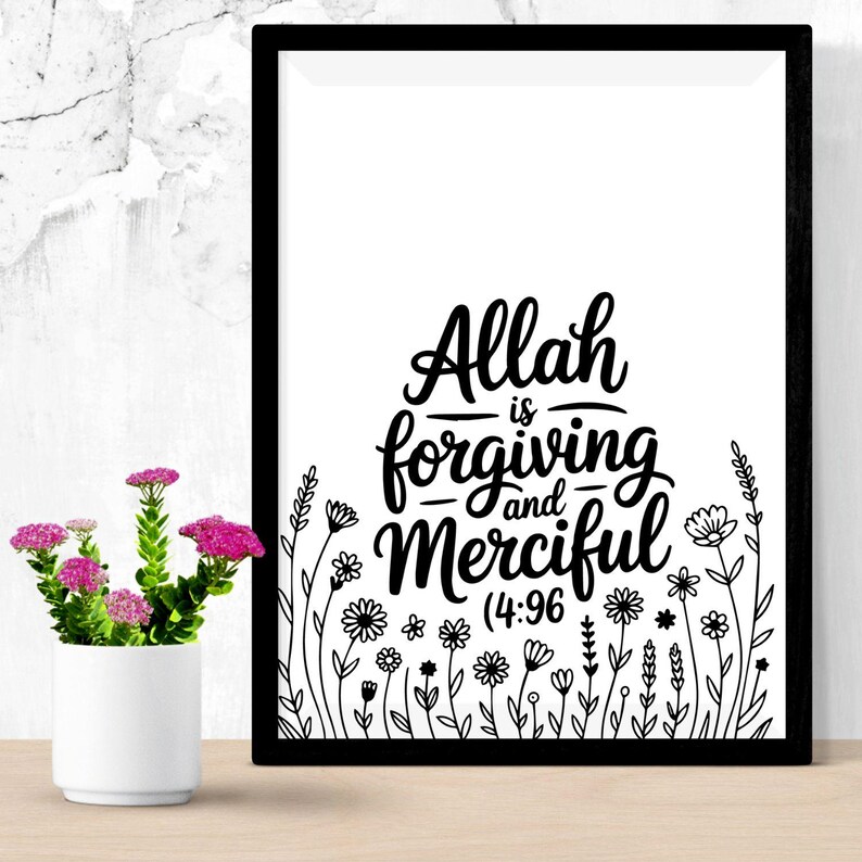 May include: A framed black and white print with the words "Allah is Forgiving and Merciful (4:96)". The print features floral illustrations at the bottom. A small white vase with pink flowers sits to the left of the frame.