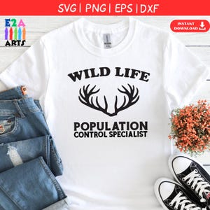 May include: White t-shirt featuring the text "WILD LIFE" above a deer antler graphic and the text "POPULATION CONTROL SPECIALIST". The shirt is styled with blue jeans and black and white trainers.