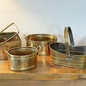 May include: A set of three ceramic mugs with a speckled, matte finish in cream, light grey, and dark grey. Each mug has a simple, minimalist design, suitable for coffee or tea.