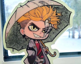 May include: A cartoon-style acrylic charm featuring a character with spiky blonde hair, a gray coat, and a red shirt, holding a patterned umbrella. The character has a mischievous expression and a cigarette. The charm has a yellow loop for hanging.