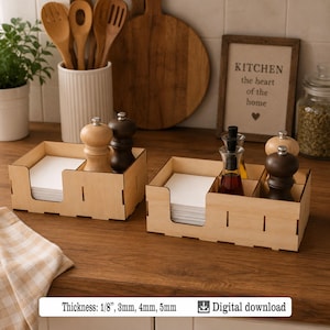 May include: Two wooden napkin holders with white napkins, salt and pepper shakers, and glass bottles. A framed picture displays the text "KITCHEN the heart of the home". The image also includes the text "Thickness: 1/8", 3mm, 4mm, 5mm".