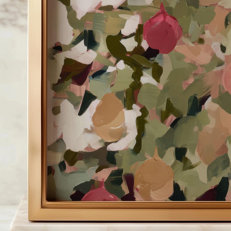 May include: Abstract floral painting in a gold frame. The artwork features brushstrokes of pink, white, green, and tan. The painting is displayed on a white marble surface.