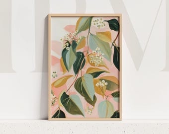 May include: A framed botanical art print depicting a colourful illustration of leaves and white flowers. The artwork features green, yellow, and blue leaves set against a soft pink backdrop. The print is enclosed in a natural wood frame.