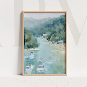 May include: An abstract painting in a light wooden frame depicts a serene river scene. The artwork features boats, swimmers, and lush green trees along the riverbanks. The color palette includes shades of blue, green, and white, creating a calming atmosphere.