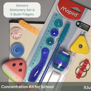 May include: A sensory stationery set and five quiet fidgets including a Maped ruler with textured sensory elements, a yellow triangle fidget, a watermelon-shaped object, a blue circular fidget, a pink swirl, and a red ring keychain on a canvas pouch.