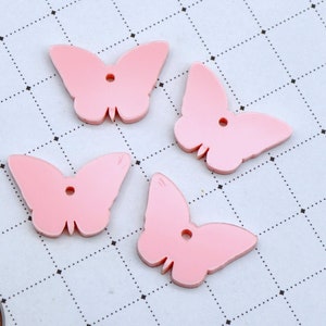 Lichtroze VLINDER CHARMS in helder groenblauw laser gesneden acryl