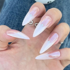 Light pink french nails/Silver star press ons/Simple fake nails/Hot gel nails/Unique acrylic nails/Elegant holiday manicure/Wedding nails