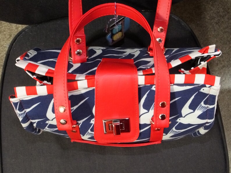 copper and silver hardware and turn clasp closure American Bluebird Nora Doctor Bag structured purse with red vinyl handles