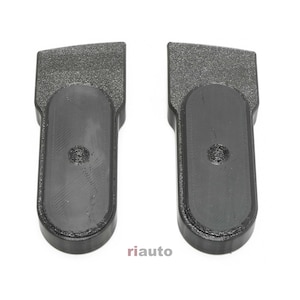 May include: Two black plastic automotive parts are displayed against a white background. Each part has a textured rectangular top and an oval-shaped base. The brand name "riauto" is printed on the bottom.