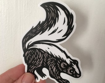 May include: Black and white illustration of a skunk with a white stripe down its back. The skunk is facing the left side of the image and has its tail raised.