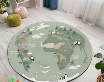 May include: A round, sage green play mat featuring a world map design with continents, oceans, and animal illustrations. The mat includes the text "Little dream" and is suitable for children's play areas.