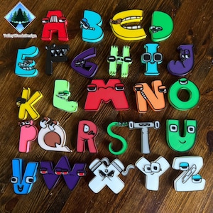 May include: A collection of twenty-six individual alphabet letters, each designed as a unique character with distinct facial features, expressions, and colors. The letters are arranged in rows, featuring a variety of shapes, eyes, and mouths.