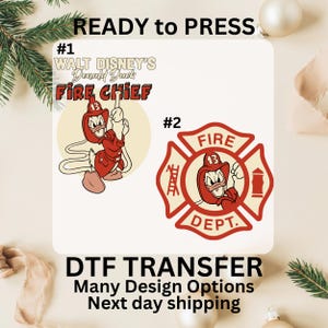 May include: Two DTF transfer designs featuring Donald Duck as a fire chief. One design shows Donald Duck holding a hose, and the other is a fire department emblem with Donald Duck. The text "READY to PRESS" is at the top.