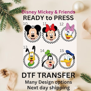 May include: A DTF transfer sheet featuring Disney's Mickey & Friends. The sheet includes images of Mickey Mouse, Minnie Mouse, Daisy Duck, Goofy, and Donald Duck, each within a checkered circle. The text "READY to PRESS" is visible.
