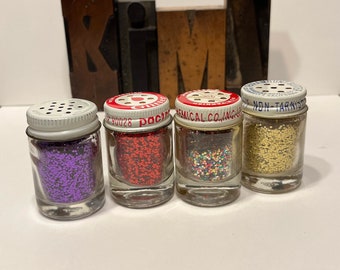 glitter small shaker bottles. 1 jar. purple, gold, red, multi. pactra paramount