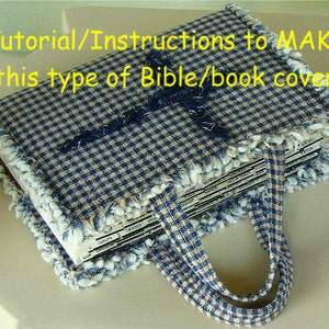 May include: A blue and white gingham fabric book cover with a frayed edge and a matching fabric handle. The cover is designed to protect a Bible or other book.