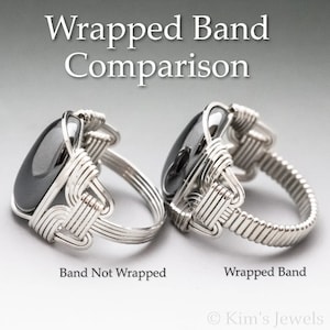 May include: Two silver rings with a black gemstone. The ring on the left has a plain band, while the ring on the right has a wrapped band. The text "Band Not Wrapped" is below the left ring, and the text "Wrapped Band" is below the right ring. The text "Kim's Jewels" is at the bottom of the image.