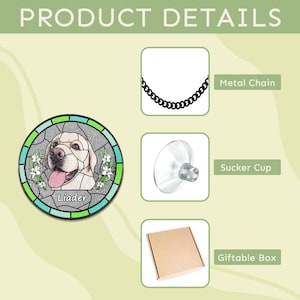 May include: A stained glass suncatcher featuring a white Labrador Retriever with the name "Lieder" inscribed below. The suncatcher is surrounded by a green and blue border and includes white flowers. The suncatcher can be hung with a metal chain or attached to a window with a suction cup. It comes in a gift box.