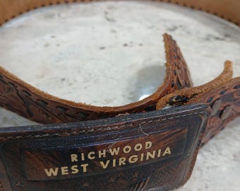 Tooled leather western style mens belt.