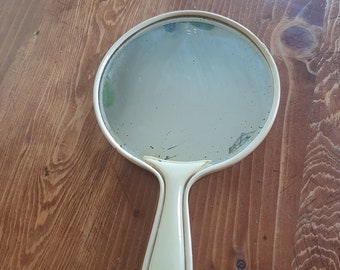 Vintage yellow celluloid hand mirror