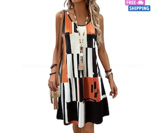 May include: Sleeveless dress with a geometric pattern in black, white, and orange. The dress has a scoop neckline and a flared skirt. A long beaded necklace with a tassel is worn with the dress.