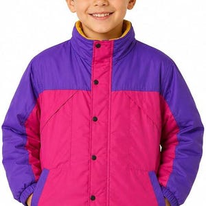 May include: A colour-blocked jacket featuring a vibrant purple upper section and a bright pink lower section. The jacket has a high collar, a front snap-button closure, long sleeves with elastic cuffs, and two side pockets. The interior lining is yellow.
